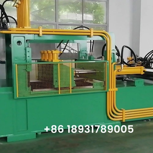 Close-up of an Ausin corrugated fin forming machine showing precision hydraulic lines and safety guarding.