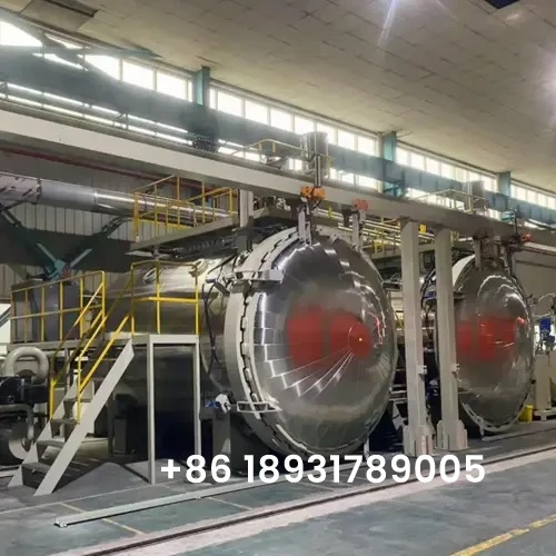Large-scale dual chamber Ausin transformer vacuum drying oven installed in a modern transformer manufacturing workshop.